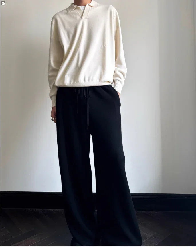 Loose cream knit pullover with collar paired with wide-leg black drawstring pants