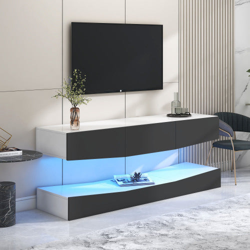 Modern grey particleboard hanging TV stand with LED lighting and storage compartments under a mounted flat-screen TV in a stylish living room setting