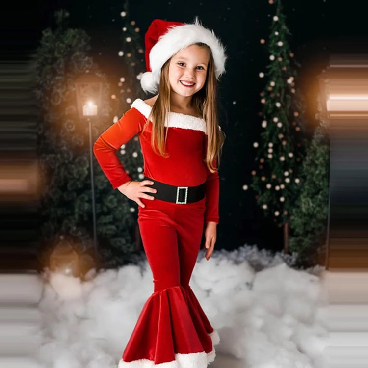 Girl in red velvet Christmas outfit with faux fur trim and bell-bottom pants, festive holiday style