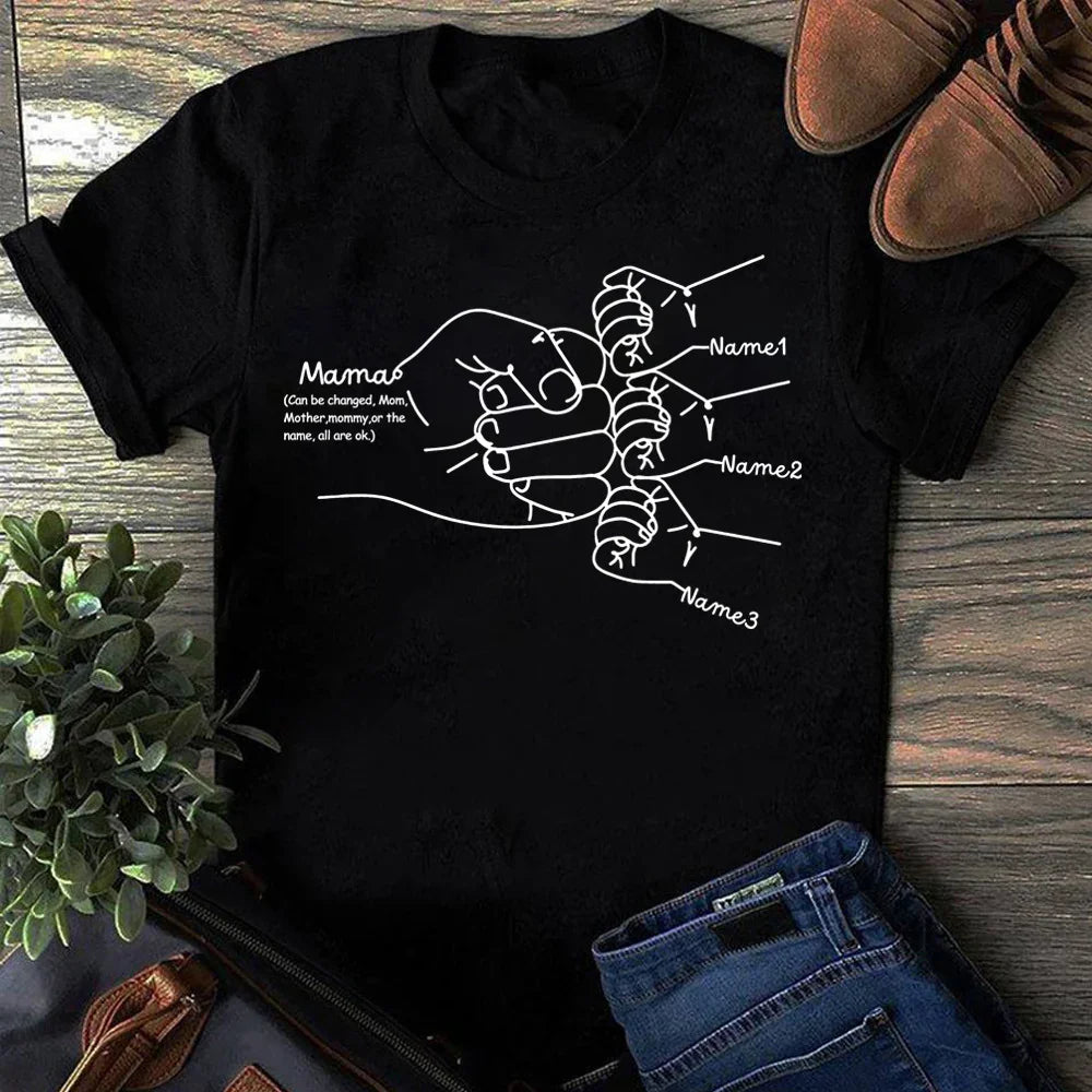 Black cotton t-shirt with white line art of mother and children holding hands, relaxed fit.