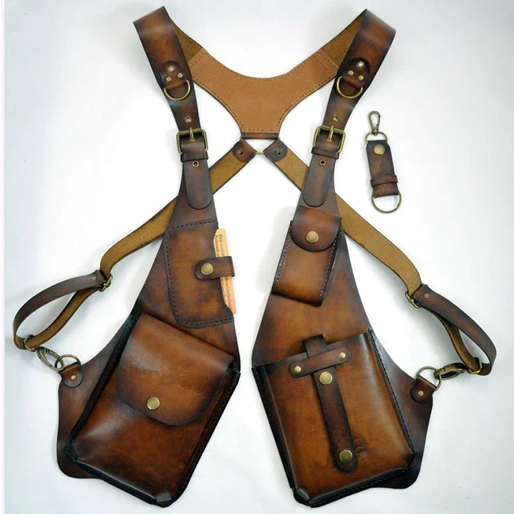 Brown leather crossbody utility harness with multiple pockets and adjustable straps, vintage style.