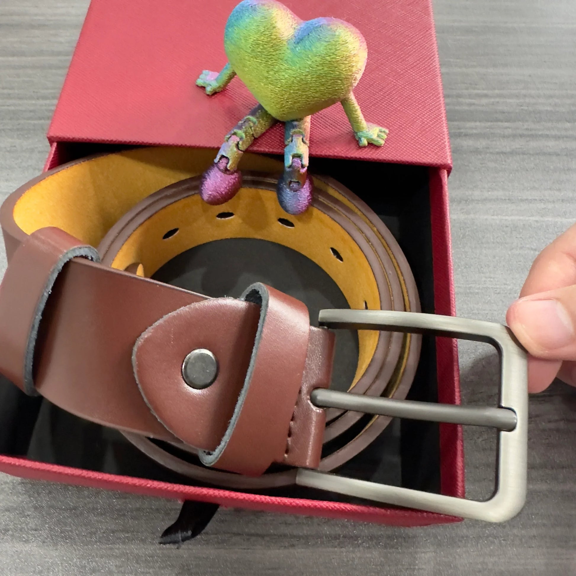 Brown leather belt with matte metal buckle in red gift box, casual style accessory