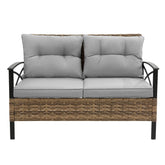 Modern outdoor loveseat with grey cushions and wicker rattan frame, metal armrests