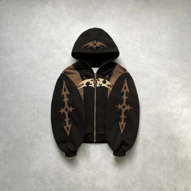 Brown and black streetwear hoodie with bold graphic details and relaxed oversized fit