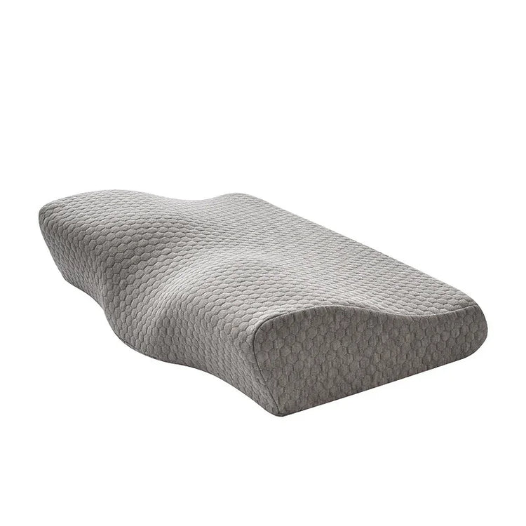 Gray ergonomic memory foam pillow with textured cover and contoured shape for neck support