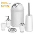White and silver 6-piece bathroom accessories set including trash can, soap dispenser, toothbrush holder, tumbler, soap dish, and toilet brush.