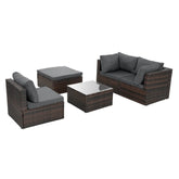 Outdoor patio set with brown wicker frames and dark gray cushions, includes sofa, chairs, ottoman, and glass-top coffee table.