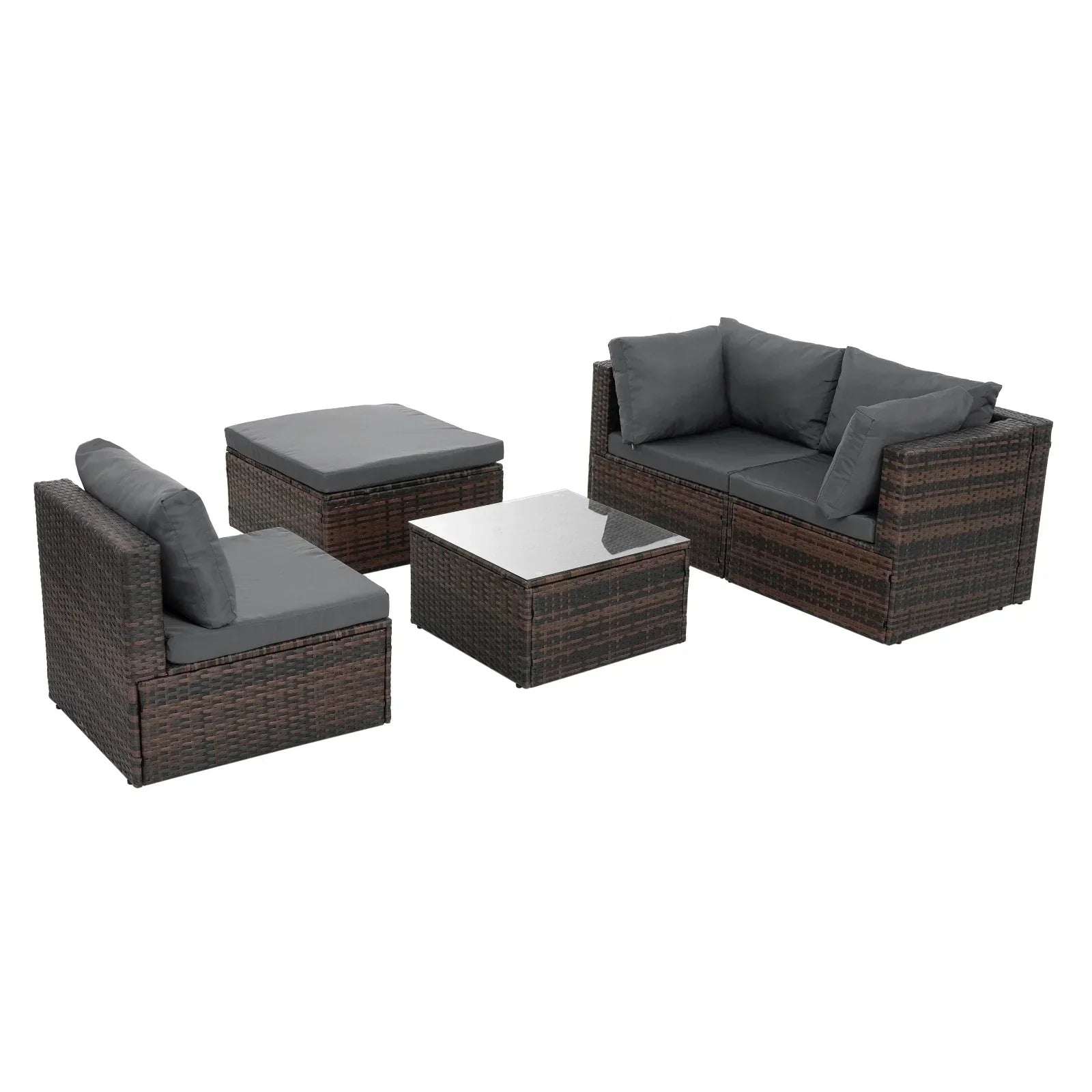 Outdoor patio set with brown wicker frames and dark gray cushions, includes sofa, chairs, ottoman, and glass-top coffee table.