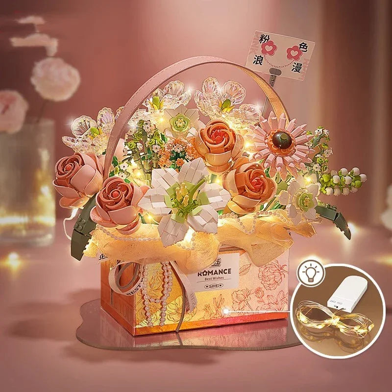 Artificial pink and white floral arrangement with LED fairy lights in a decorative box