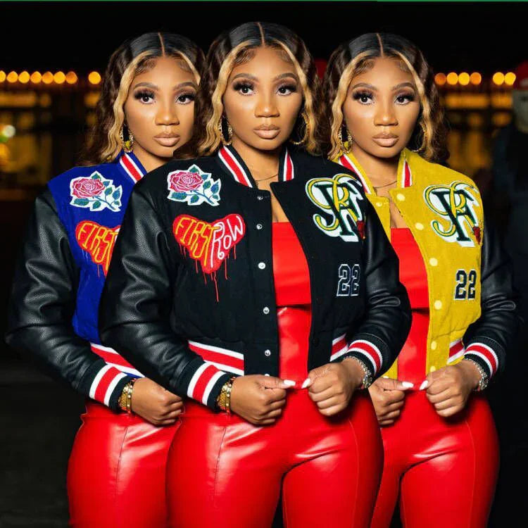 Women in colorful streetwear varsity jackets with patches, red faux leather pants, fitted style