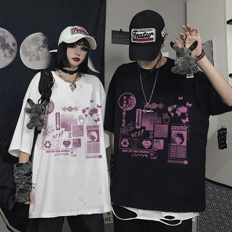 Two people wearing oversized streetwear t-shirts, one white and one black, both with bold purple futuristic graphic prints, loose fit, casual style.