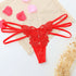 Red lace butterfly thong with strappy sides, floral embroidery, and rhinestone accents