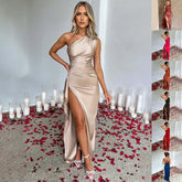 Woman in champagne satin one-shoulder evening gown with thigh-high slit, fitted silhouette