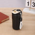Matte black insulated travel mug with digital temperature display and white carrying strap