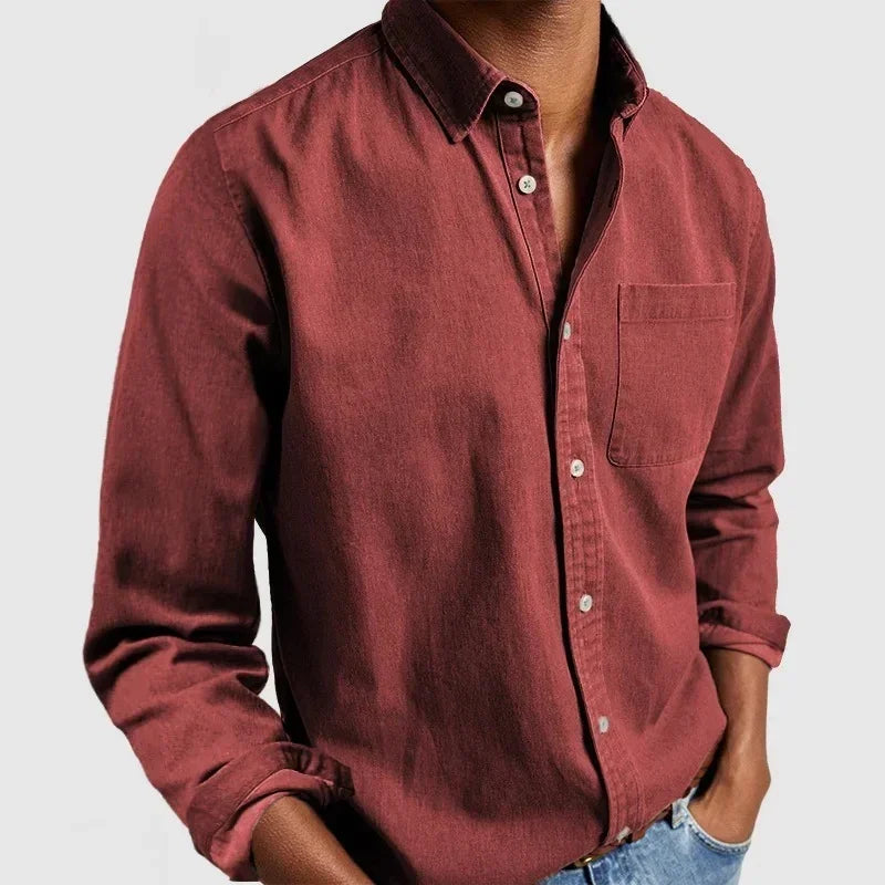 Men's casual maroon button-up shirt, long sleeves, chest pocket, relaxed fit cotton.