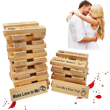 Couple in white clothing embracing beside wooden block game featuring romantic printed messages.