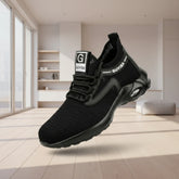 Black mesh athletic sneaker with cushioned sole and lace-up front, futuristic streetwear style