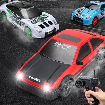 Red and black remote control car with sporty design on asphalt, LED headlights on, racing with white and blue RC cars.