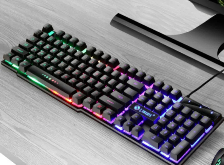 Black mechanical keyboard with RGB backlit keys, slim fit, on a modern desk setup