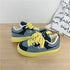 Denim patchwork sneakers with yellow laces and sole, casual streetwear style, low-top fit