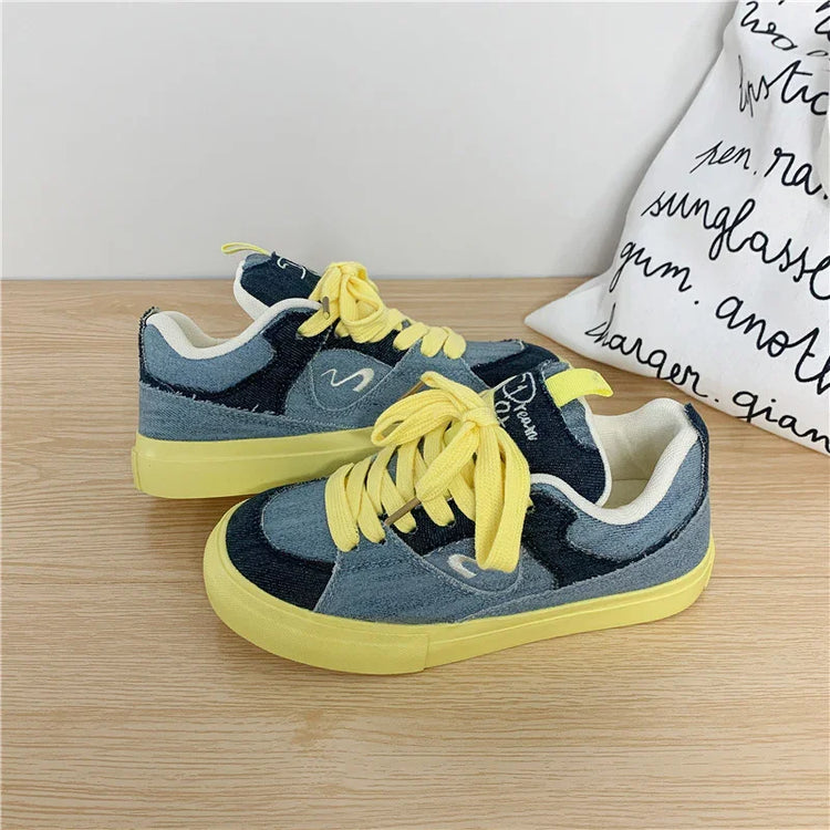 Denim patchwork sneakers with yellow laces and sole, casual streetwear style, low-top fit