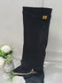 Black suede knee-high boot with gold buckle, pointed toe, and chunky low heel