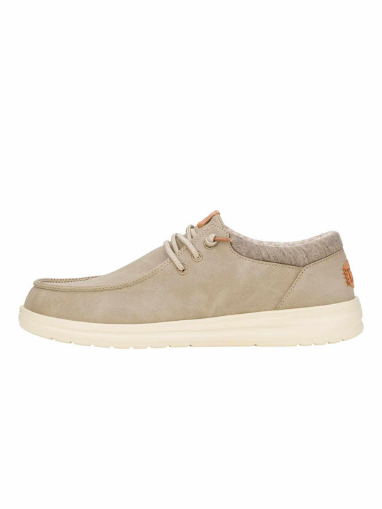Beige casual lace-up shoe with smooth synthetic material and cushioned sole, side view