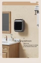 Wall-mounted bathroom heater with black grille, modern design, shown above a vanity.