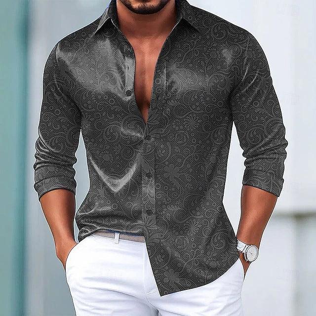 Men’s slim fit long sleeve shirt in dark grey with subtle paisley pattern, paired with white pants.
