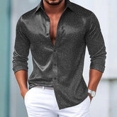 Men’s slim fit long sleeve shirt in dark grey with subtle paisley pattern, paired with white pants.