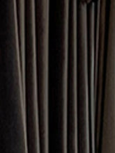 Close-up of black pleated fabric, smooth texture, modern streetwear clothing material