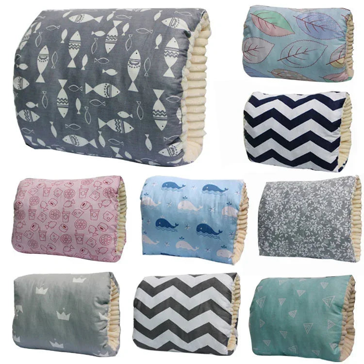 Assorted soft pillows with colorful cotton covers in fish, whale, leaf, and chevron prints.