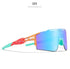 Futuristic shield sunglasses with mirrored blue lens, orange and teal frame, bold streetwear style.