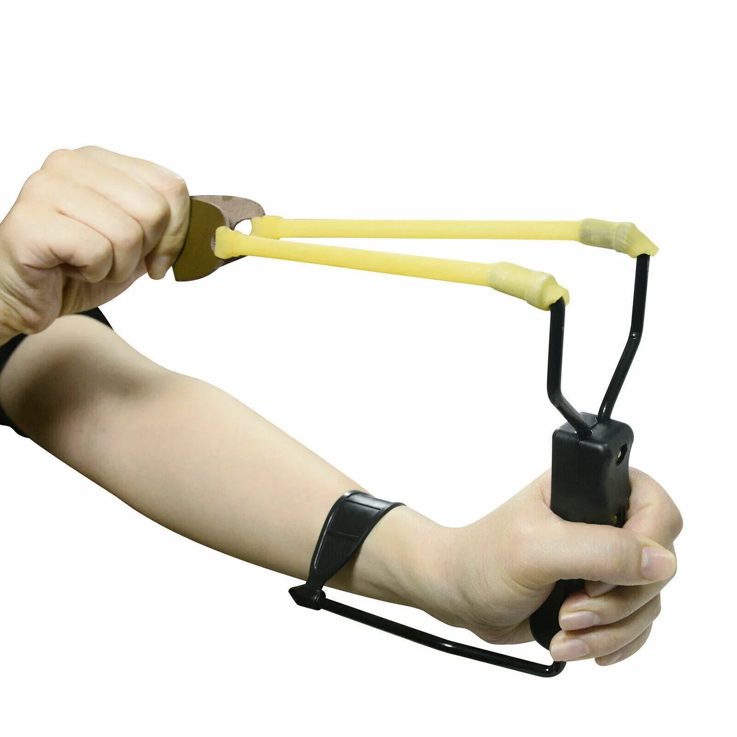 Hand holding a black ergonomic slingshot with yellow rubber bands and wrist support