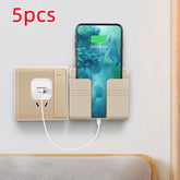 Beige wall-mounted phone holder for charging, modern minimalist plastic design, snug fit.