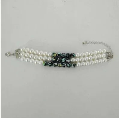 Triple strand pearl bracelet with black crystal beads, adjustable silver chain, elegant style