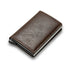 Brown leather minimalist wallet with slim design on white background