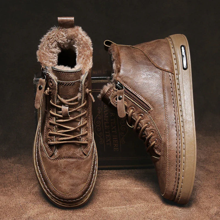 Brown leather high top sneakers with faux fur lining, side zippers, and chunky rubber soles.