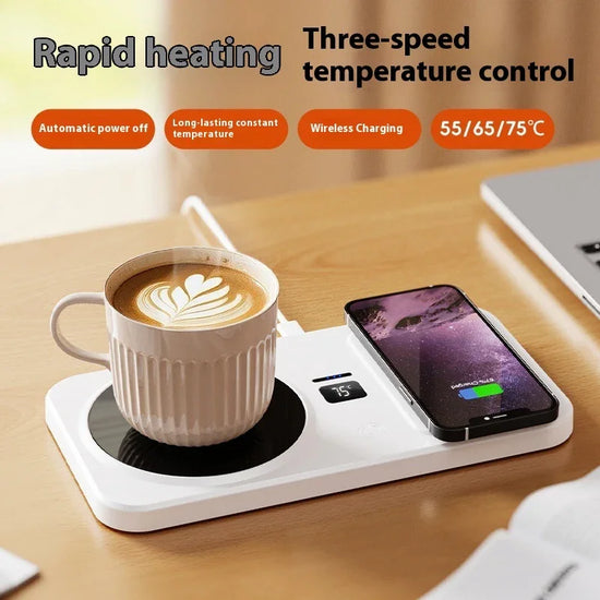 White ceramic cup with latte art on a mug warmer and smartphone on wireless charging pad