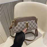 Beige and brown crossbody bag with geometric pattern, faux leather trim, compact fit