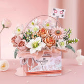 Pastel pink and white artificial flower bouquet in a decorative box, elegant and romantic style.