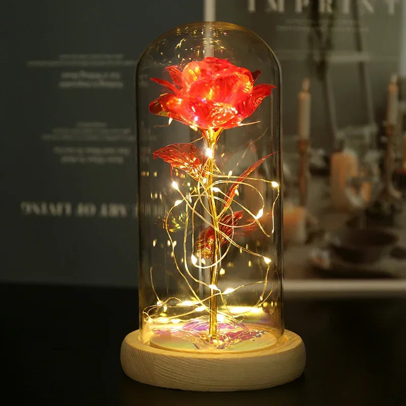 Glass dome with red artificial rose, gold stem, LED fairy lights, wood base, modern decor