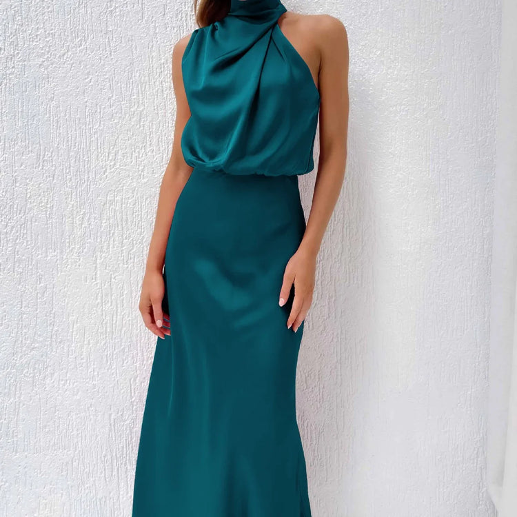 Sleeveless teal satin halter dress with draped neckline and slim fit, elegant evening style