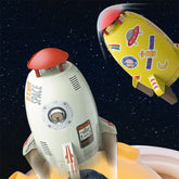 White and yellow cartoon rocket toys with space-themed stickers on a starry background.