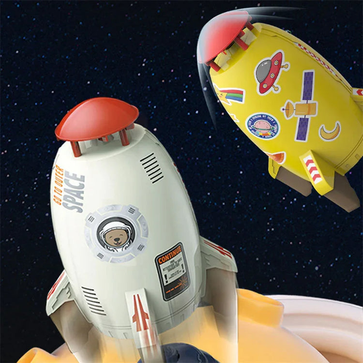 White and yellow cartoon rocket toys with space-themed stickers on a starry background.