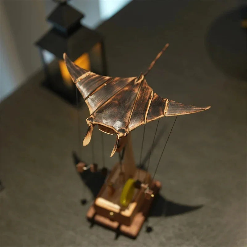 Bronze and wood kinetic sculpture with manta ray design and vintage mechanical elements