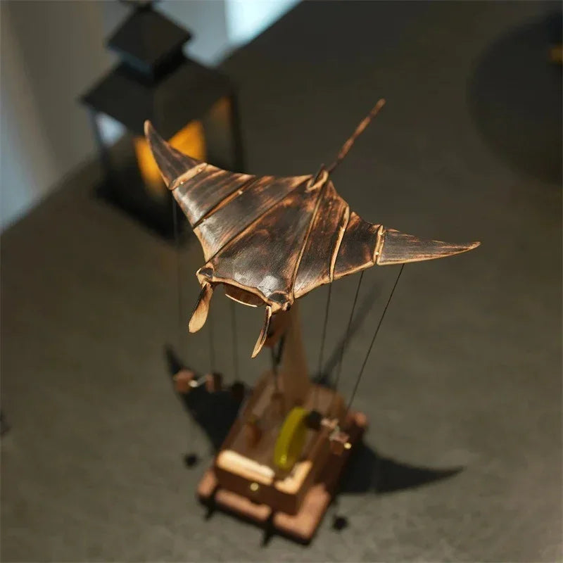 Bronze and wood kinetic sculpture with manta ray design and vintage mechanical elements