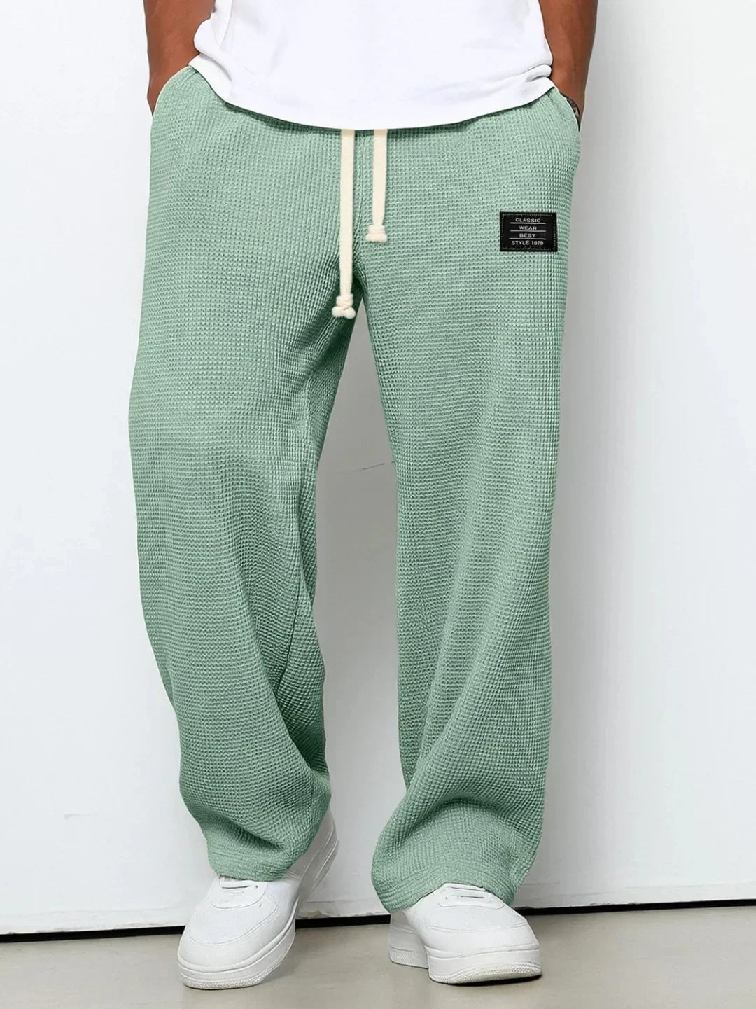 Loose fit mint green waffle knit jogger pants with drawstring waist and patch label