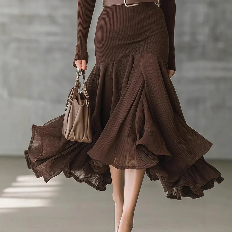 Brown ribbed long-sleeve top and flowy, high-waist pleated skirt, fitted silhouette