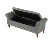 Gray upholstered storage bench with wooden legs and tufted button details, open lid
